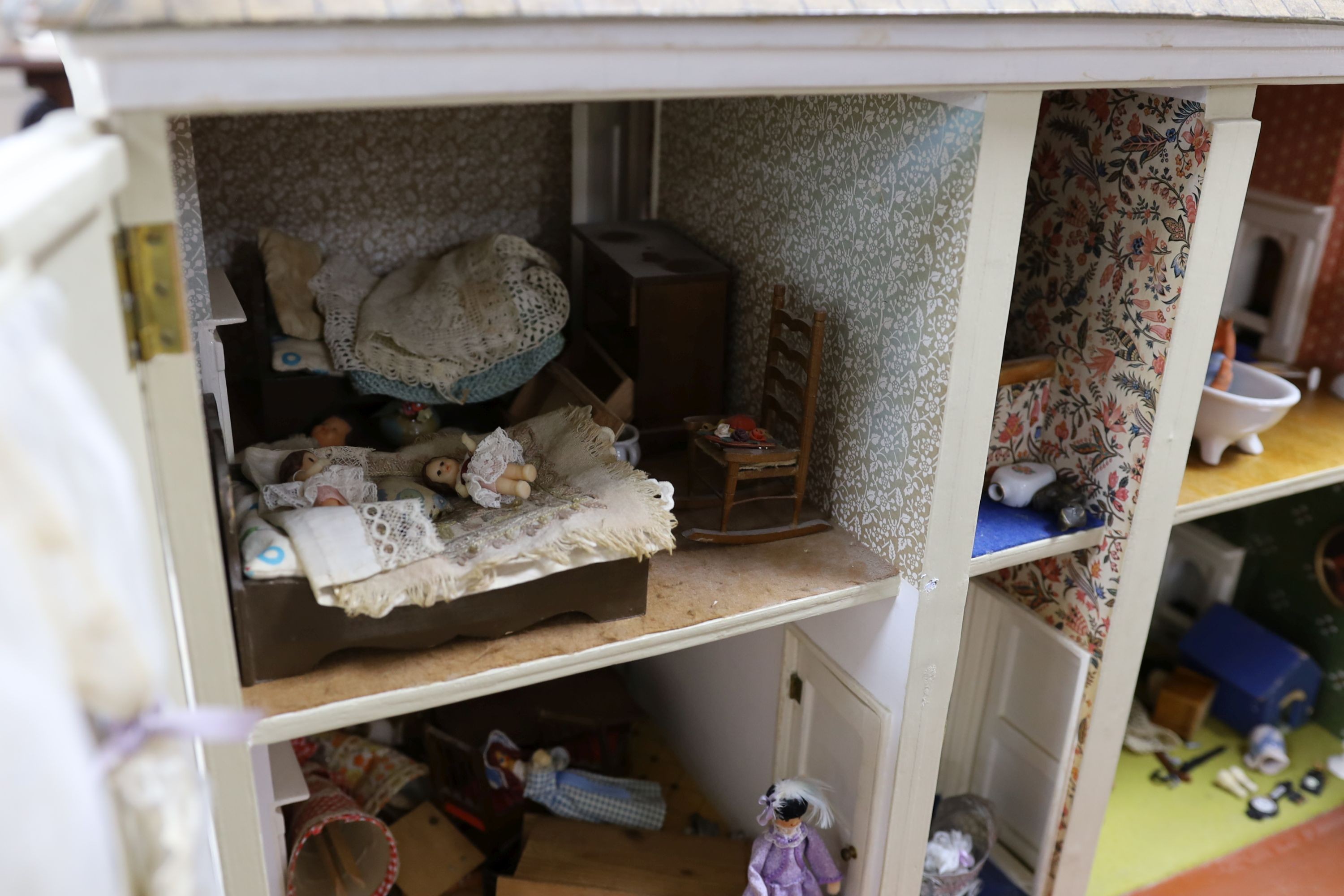 A dolls house, length 74cm, depth 39cm, height 66cm